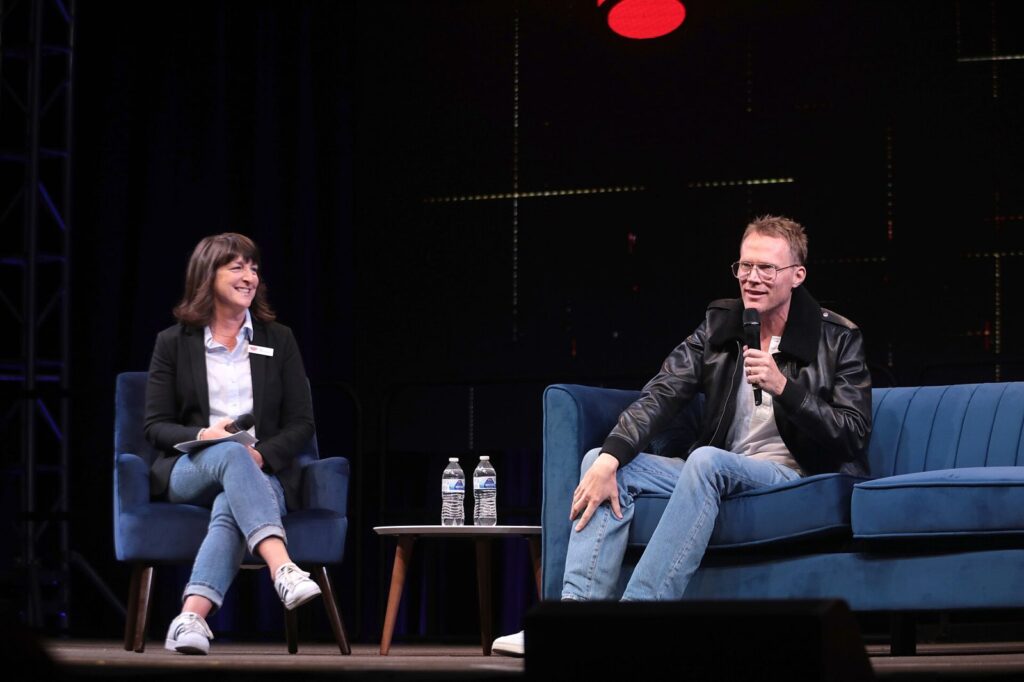 Paul Bettany, star of Marvel's VisionQuest, speaking on stage at the 2023 Phoenix Fan Fusion